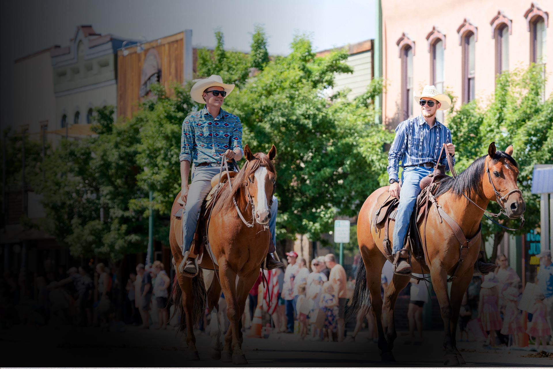 Community members ride horses down Gunnison's Main Street.
