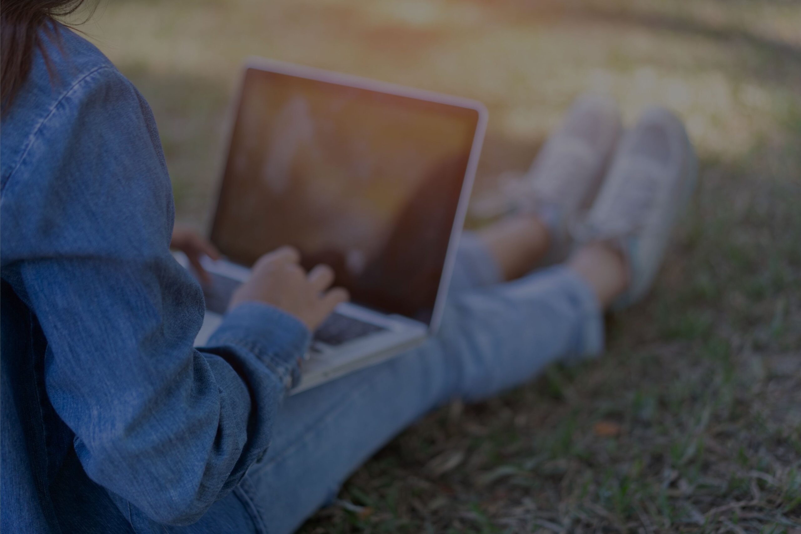A student types on a laptop.