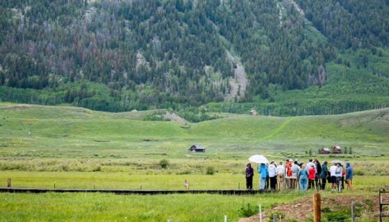People tour Western's new Verzuh Ranch property at the base of Mt. Crested Butte.