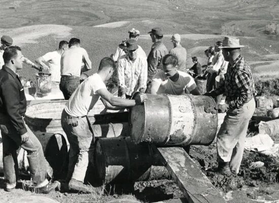 Black and white photo of students at Tenderfoot Mountain's archaeological dig site.
