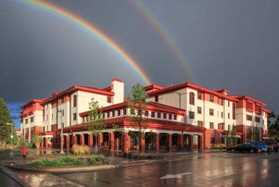 A double rainbow above the Pinnacles Apartment building.