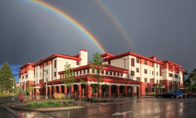 A double rainbow above the Pinnacles Apartment building.