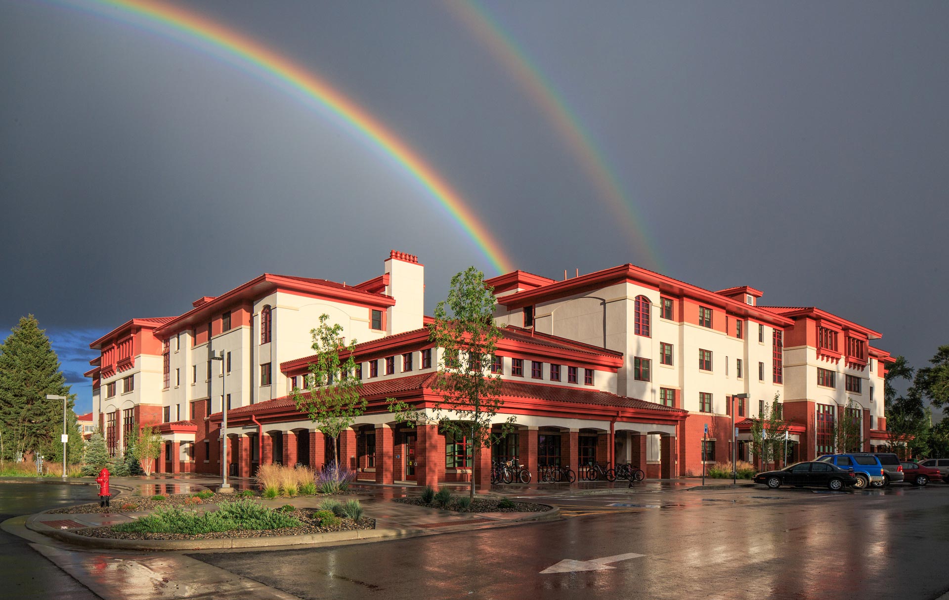 A double rainbow above the Pinnacles Apartment building.