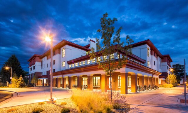 The Pinnacles Apartments exterior at blue hour.