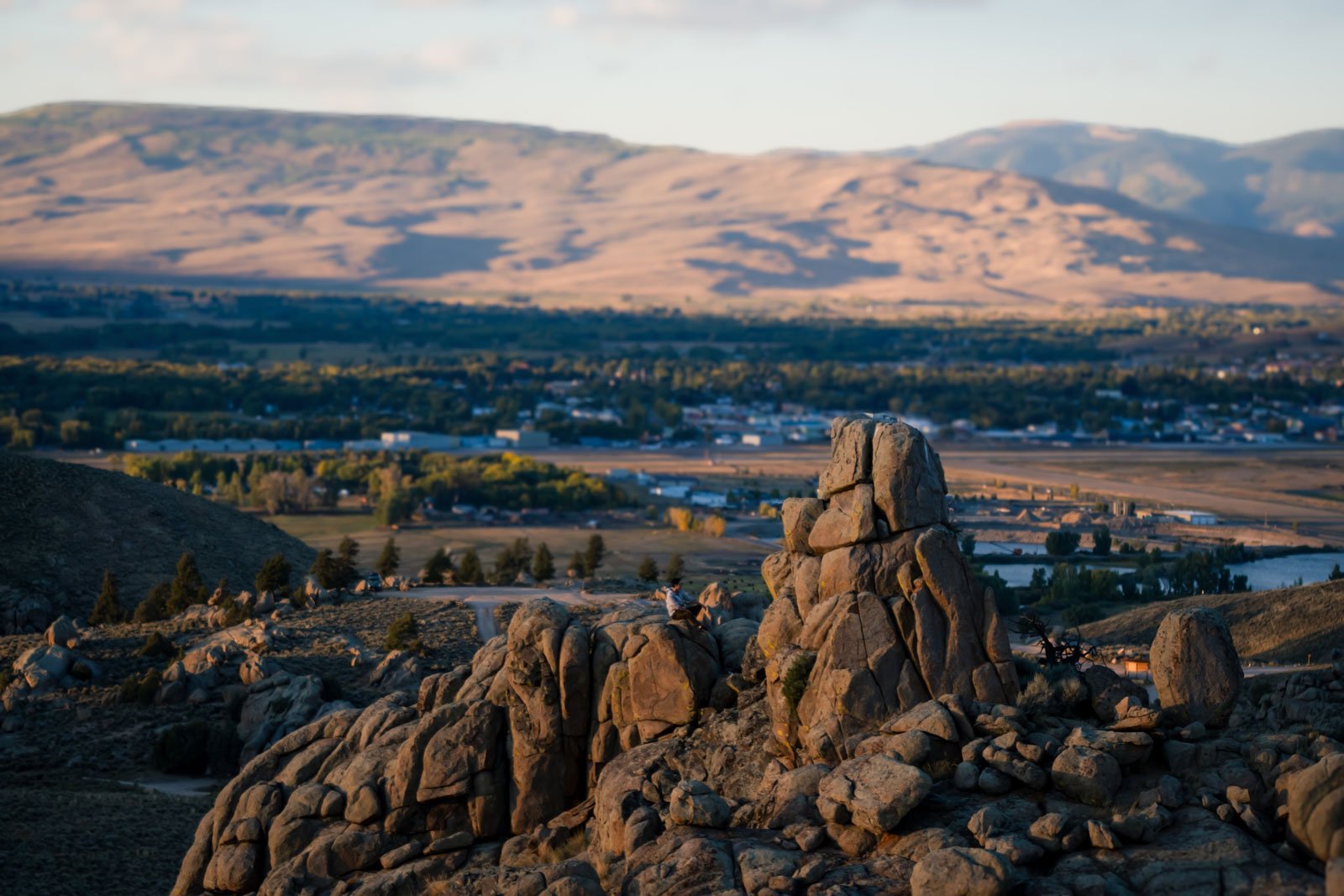 Student sitting on a rock formation at Hartmans