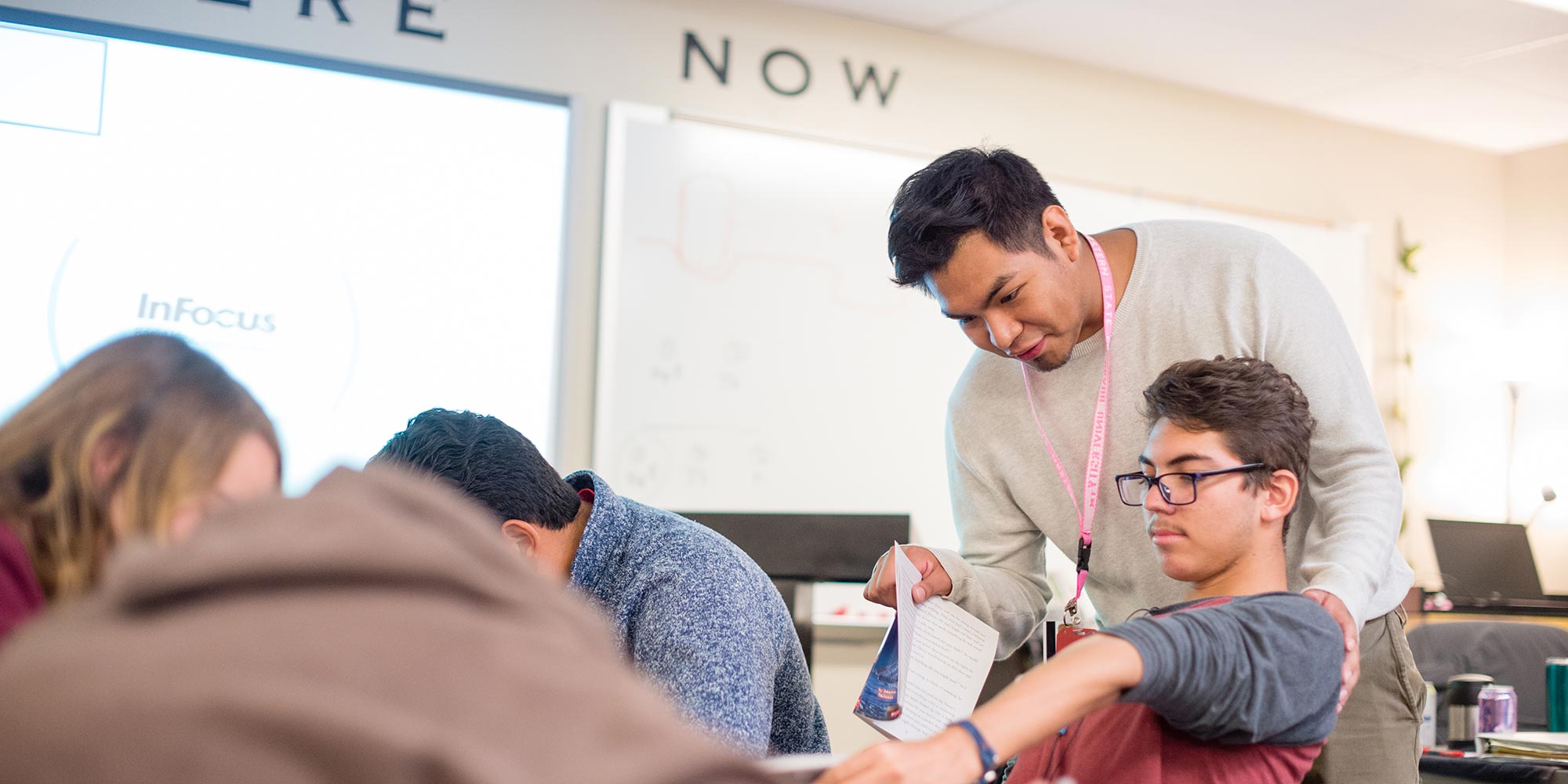 Student teacher Cristian Aguilar at Gunnison High School assisting students