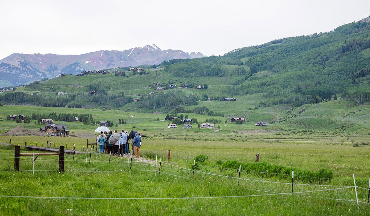 People tour Western's new Verzuh Ranch property at the base of Mt. CB