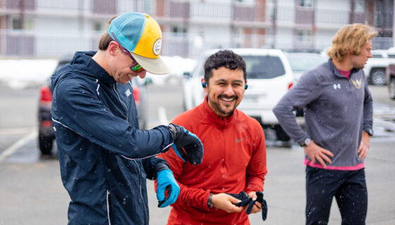 Students smile and check their watches before a time trial in a HAP class