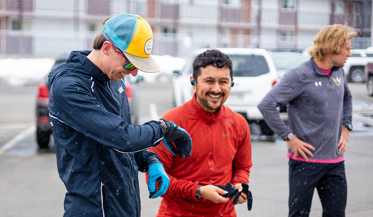 Students smile and check their watches before a time trial in a HAP class