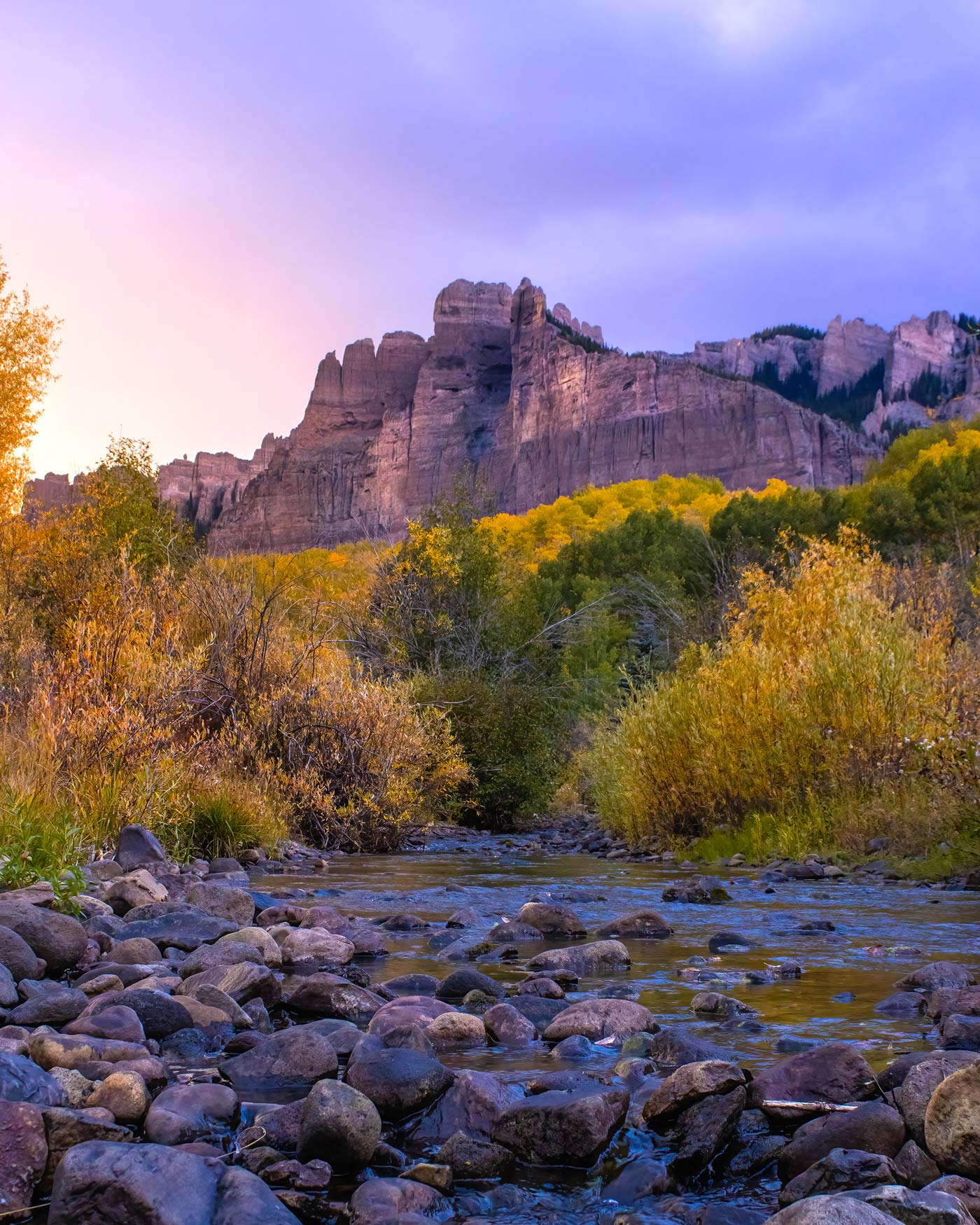 A view of the Castles rock formation with a stream in the foreground.