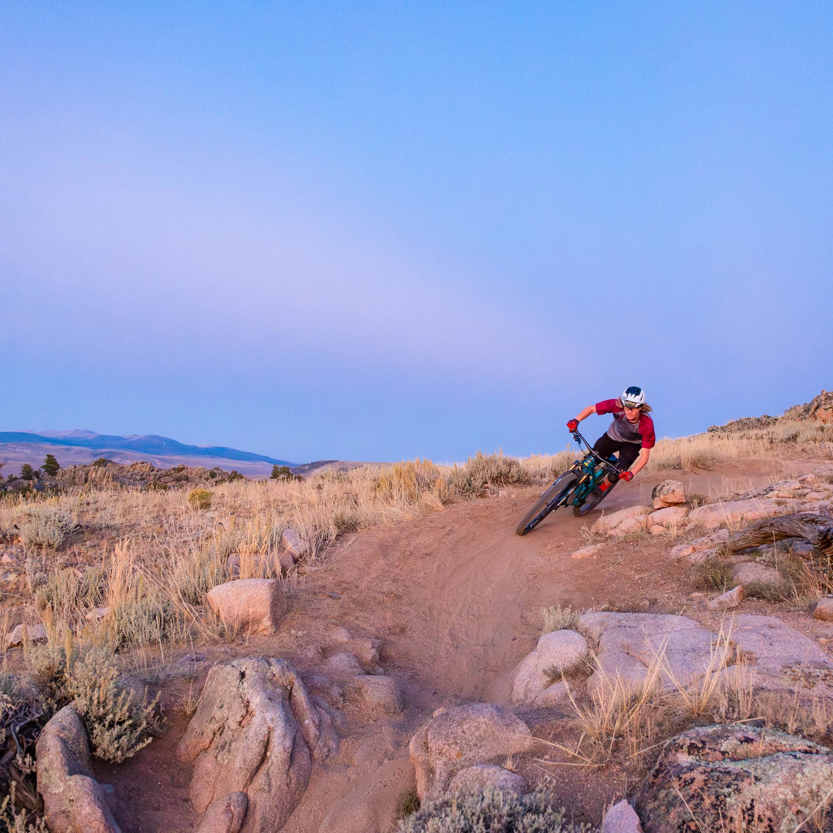 An athlete corners his mountain bike at Hartman Rocks.