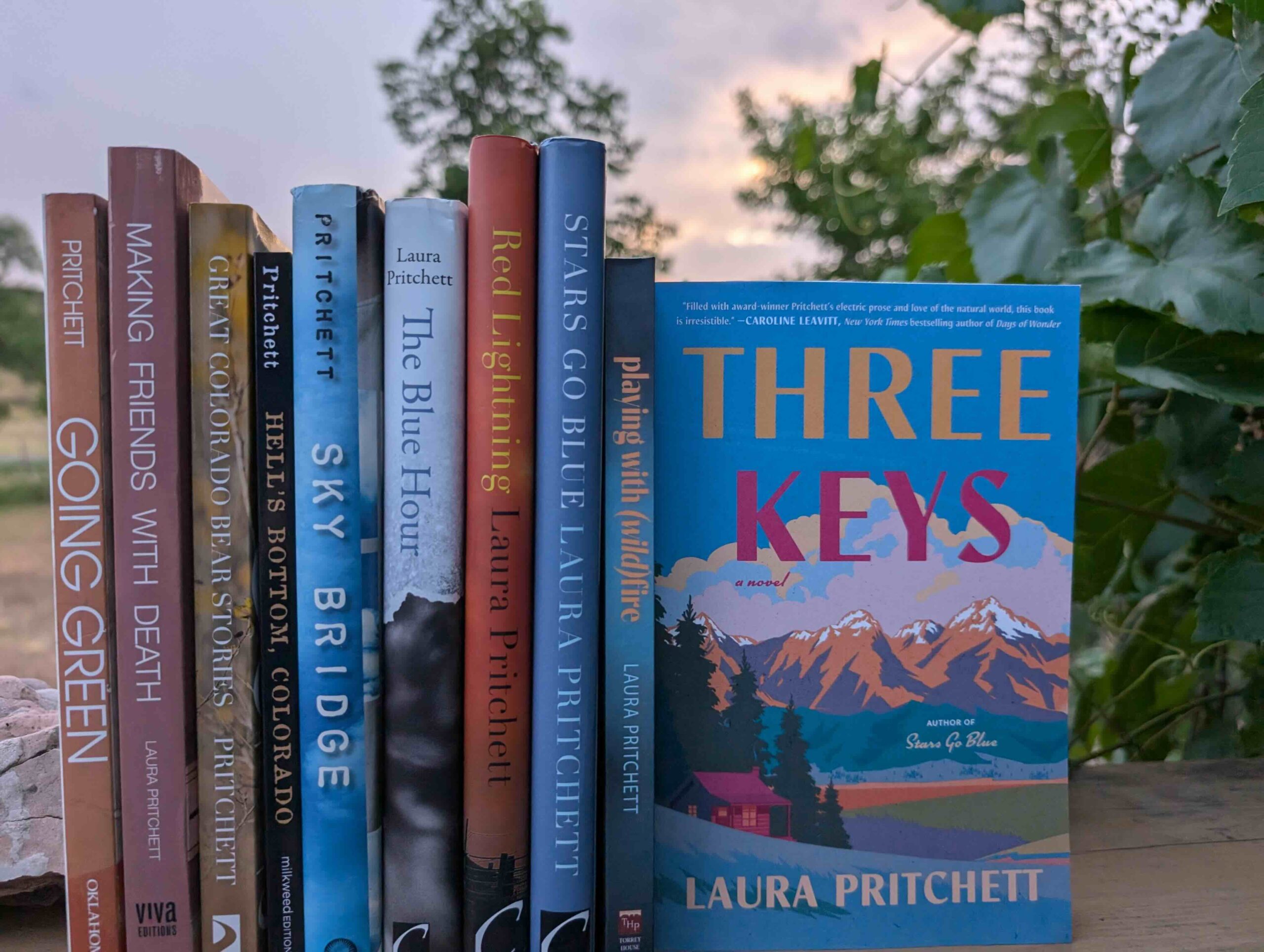 Books from the author set against a nature screen.