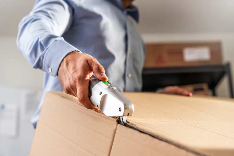 The BoxBlayde cutter slices through a cardboard box.