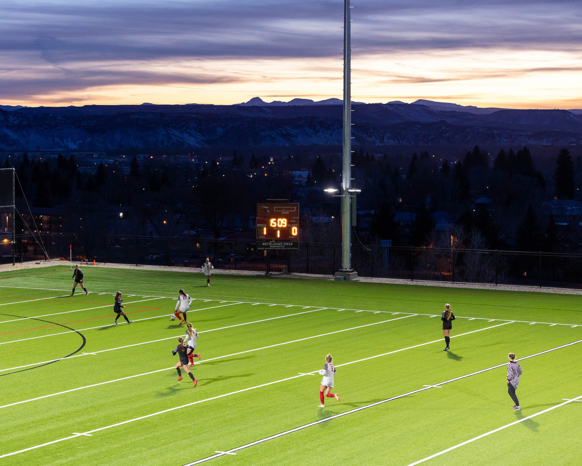 The Western Colorado University women's soccer team plays a scrimmage as the sun sets beyond Gunnison.