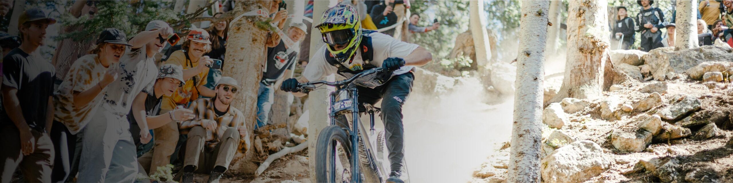 A mountain biker rides down a boulder field during a race.
