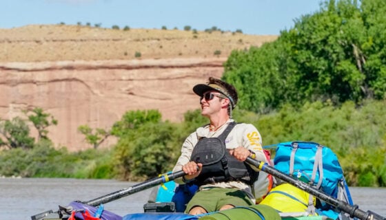 A Western student rows a raft down the Colorado River during Wilderness Pursuits' overnight trip on the Ruby Horsethief stretch.