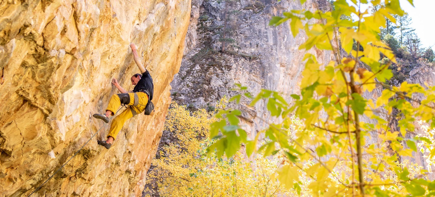 A climber ascends a sport climbing route in Rifle, CO.