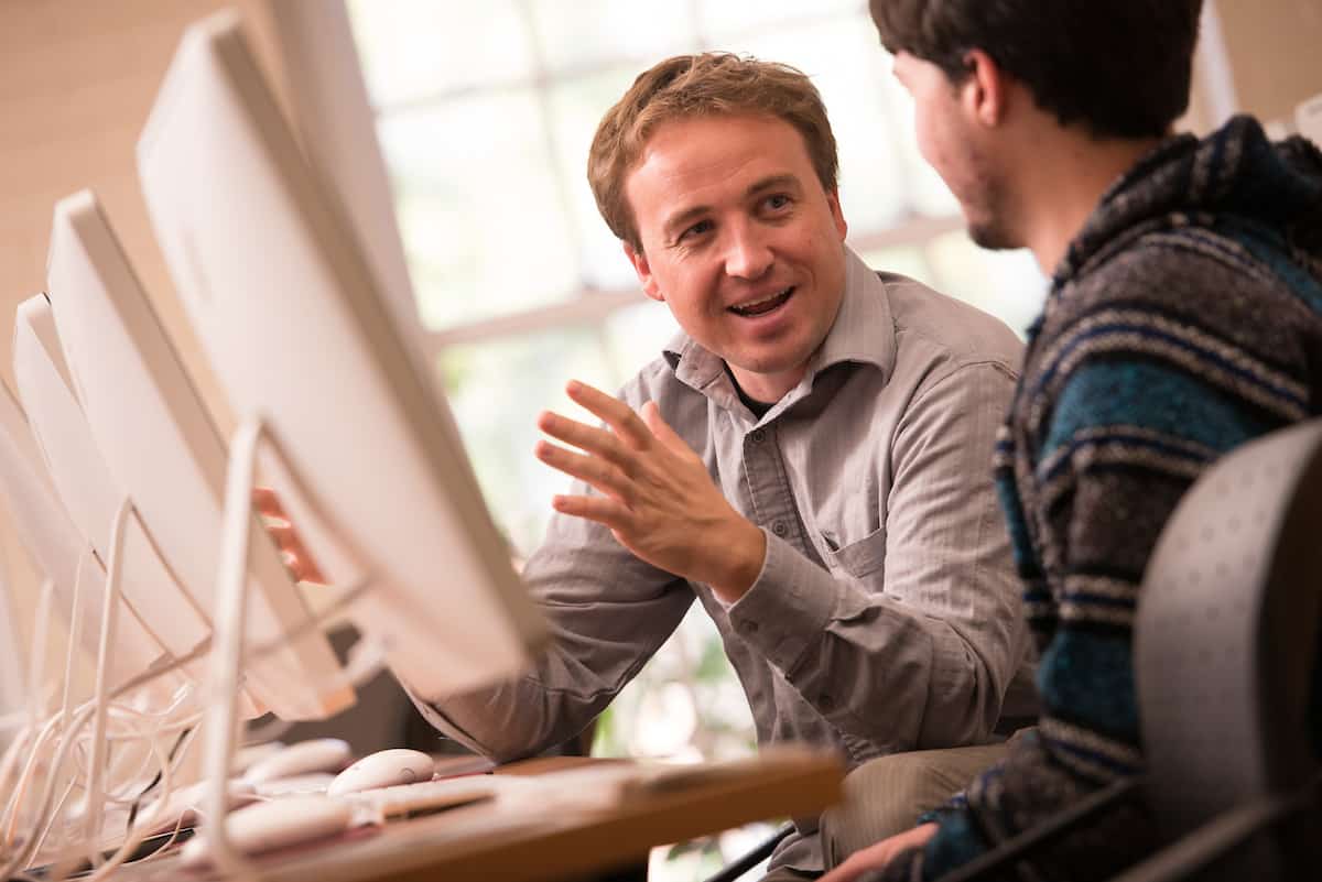 Special education graduate programs online: student and teacher in front of a computer