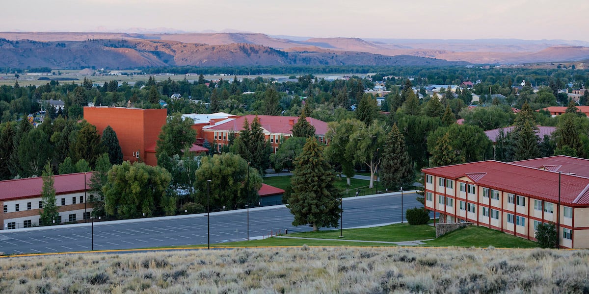 Campus at sunrise with mountains in the background.