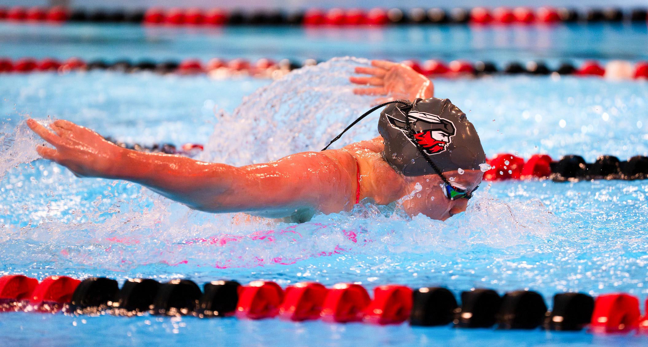 A photo of Western swim athlete during a butterfly heat.