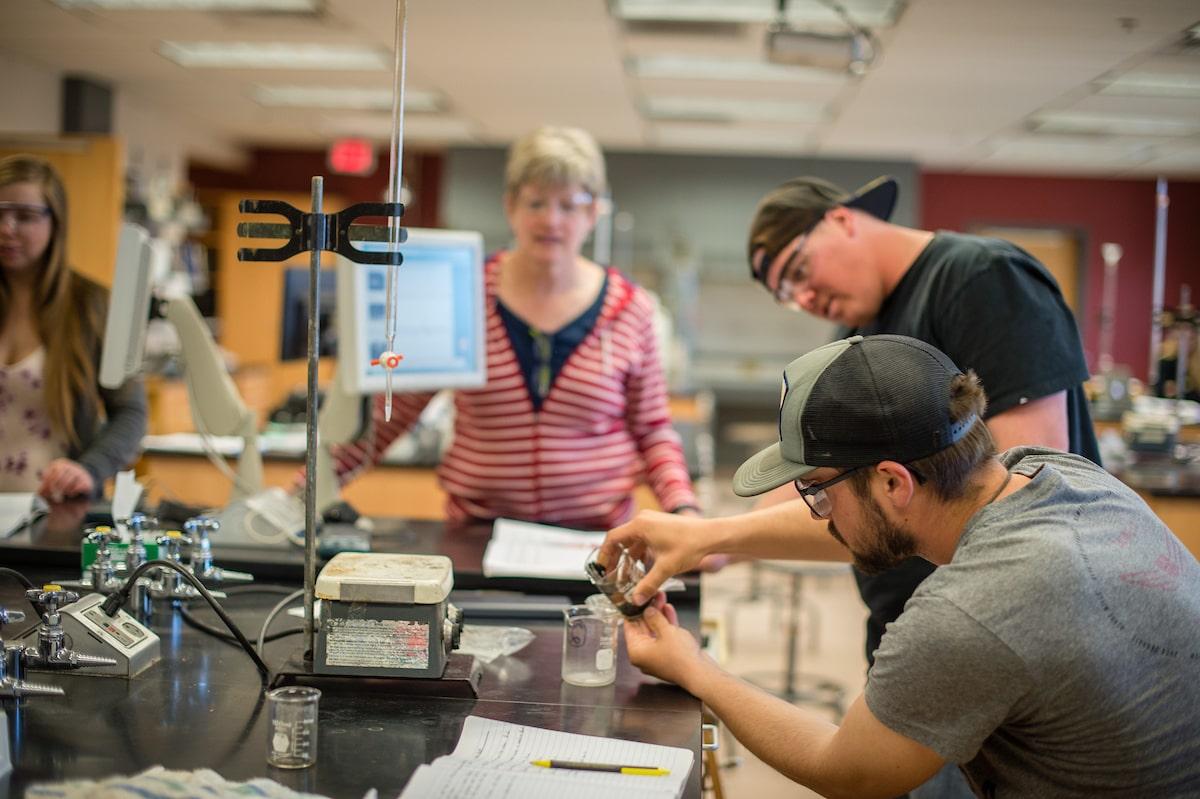 Students use testing equipments in a lab.