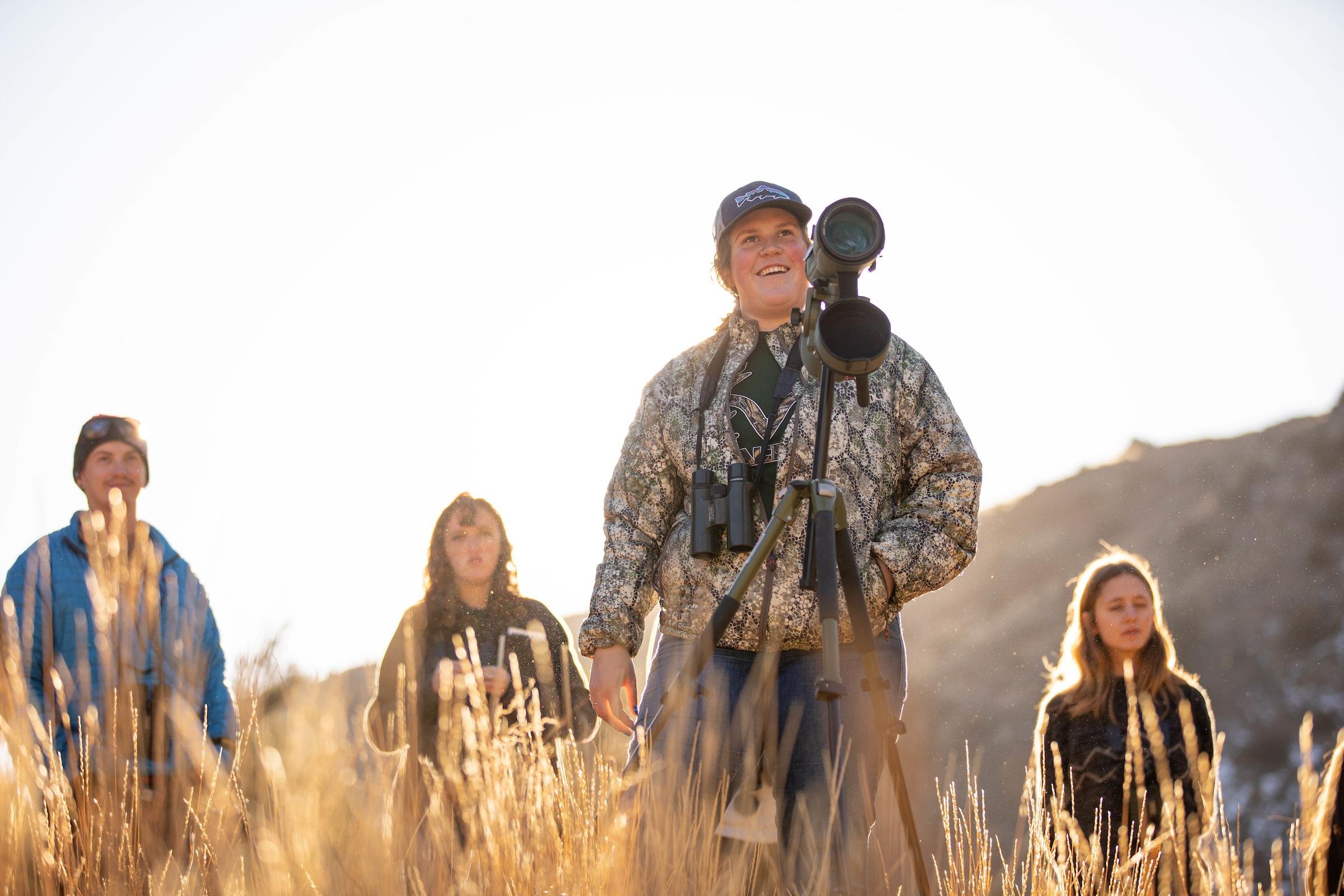 Student Bre Hawman spots a big horn sheep with her wildlife techniques class