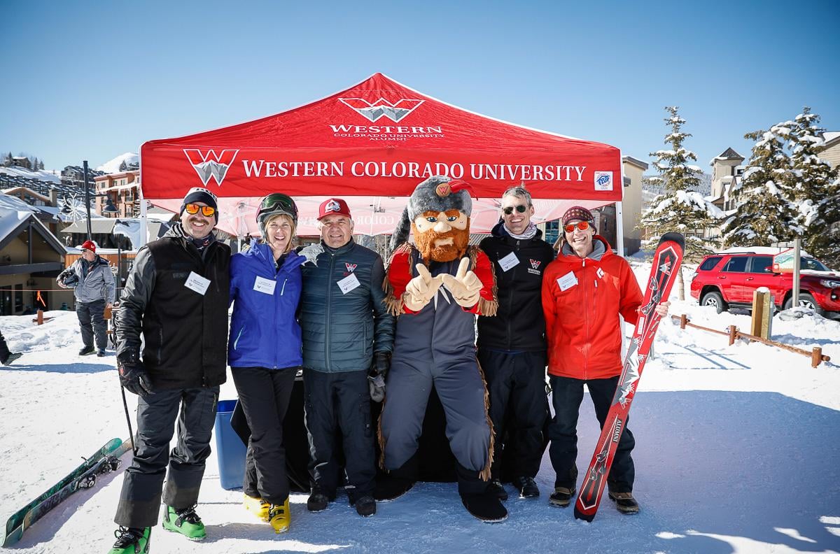 Alumni pose for a photo at Mount Crested Butte for Ski Weekend.