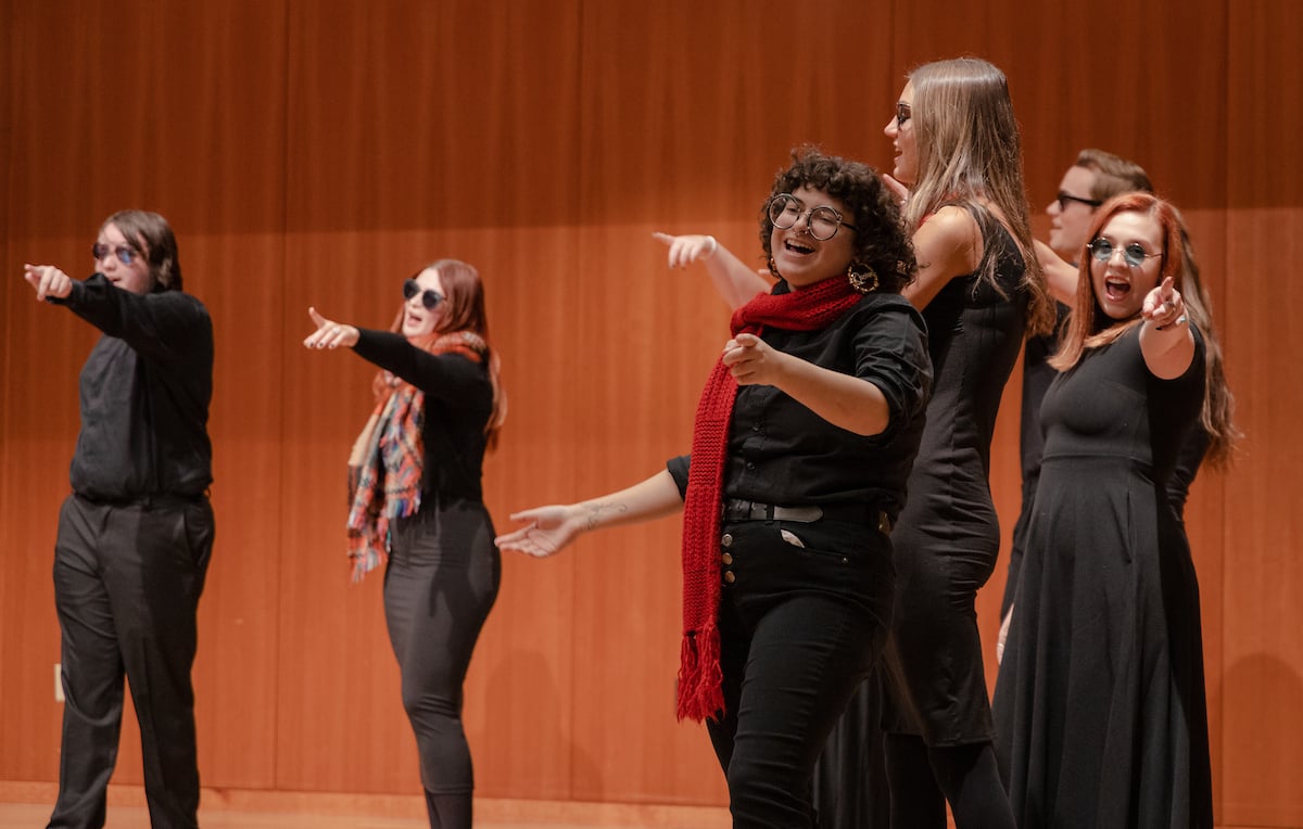 The student choir strikes a pose during their performance of 
