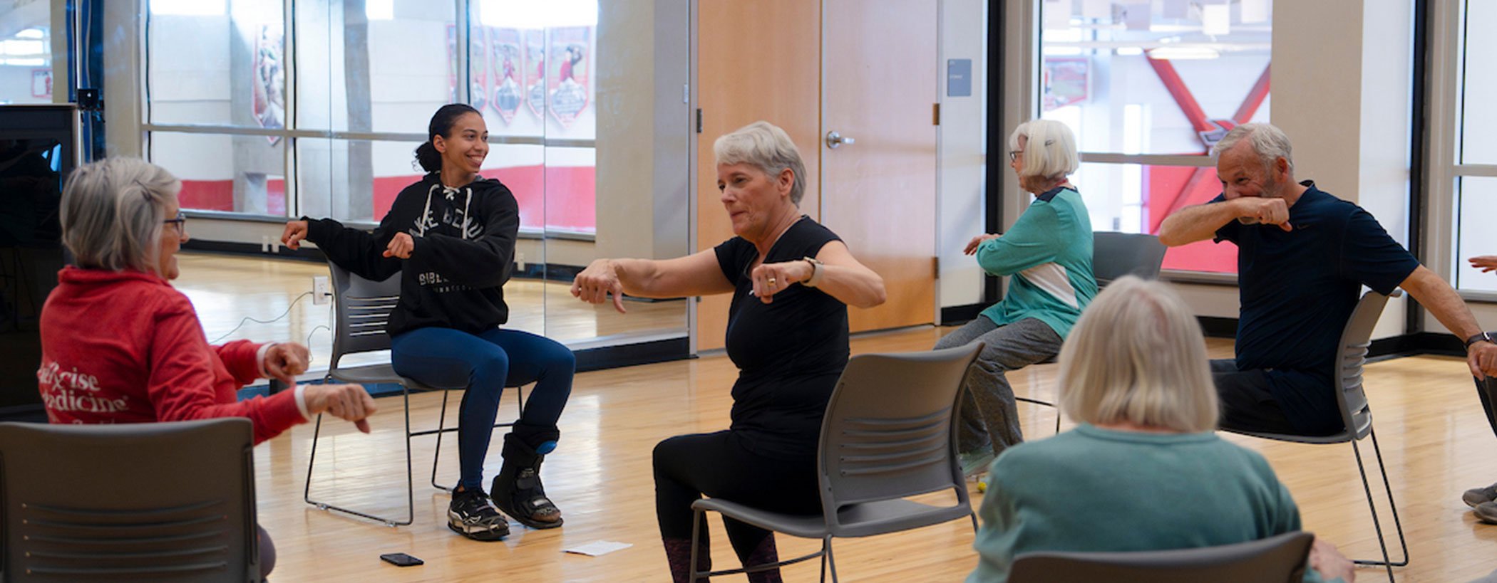 A student leads a blance class for senior community members for the Wellness Elevated program.