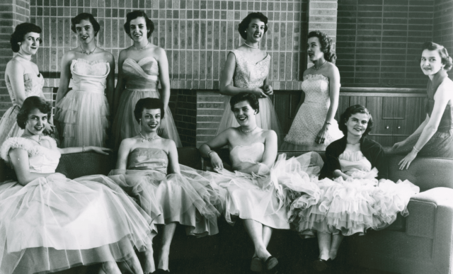 Ten WSC Homecoming royalty candidates pose for a "formal" photograph in the lounge area of the Student Union, circa 1958.